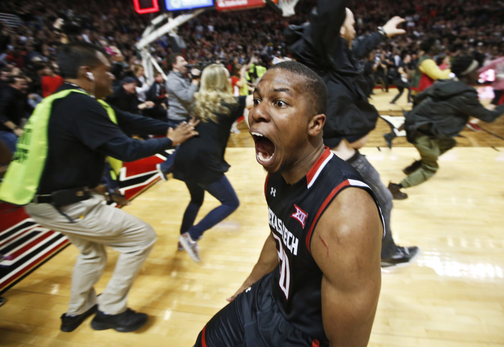 Texas Tech's Toddrick Gotcher runs toward the fans to celebrate after an NCAA basketball game on Wednesday, Feb. 17, 2016 at United Supermarkets Arena in Lubbock, Texas. Texas Tech beat Oklahoma 65-63. (AP Photo/Brad Tollefson)